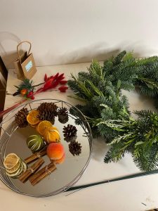 Christmas wreath with decorations on glass mirror
