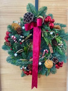 Finished Christmas wreath on wooden door