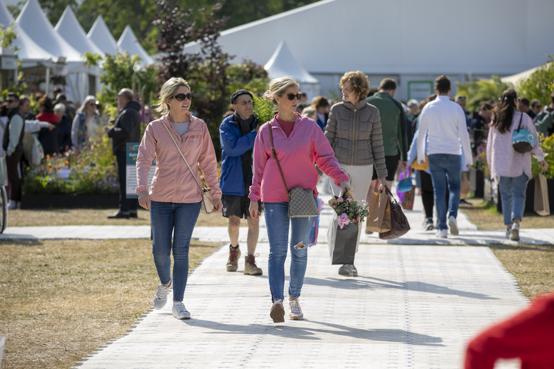 People walking through Bloom with shopping bags