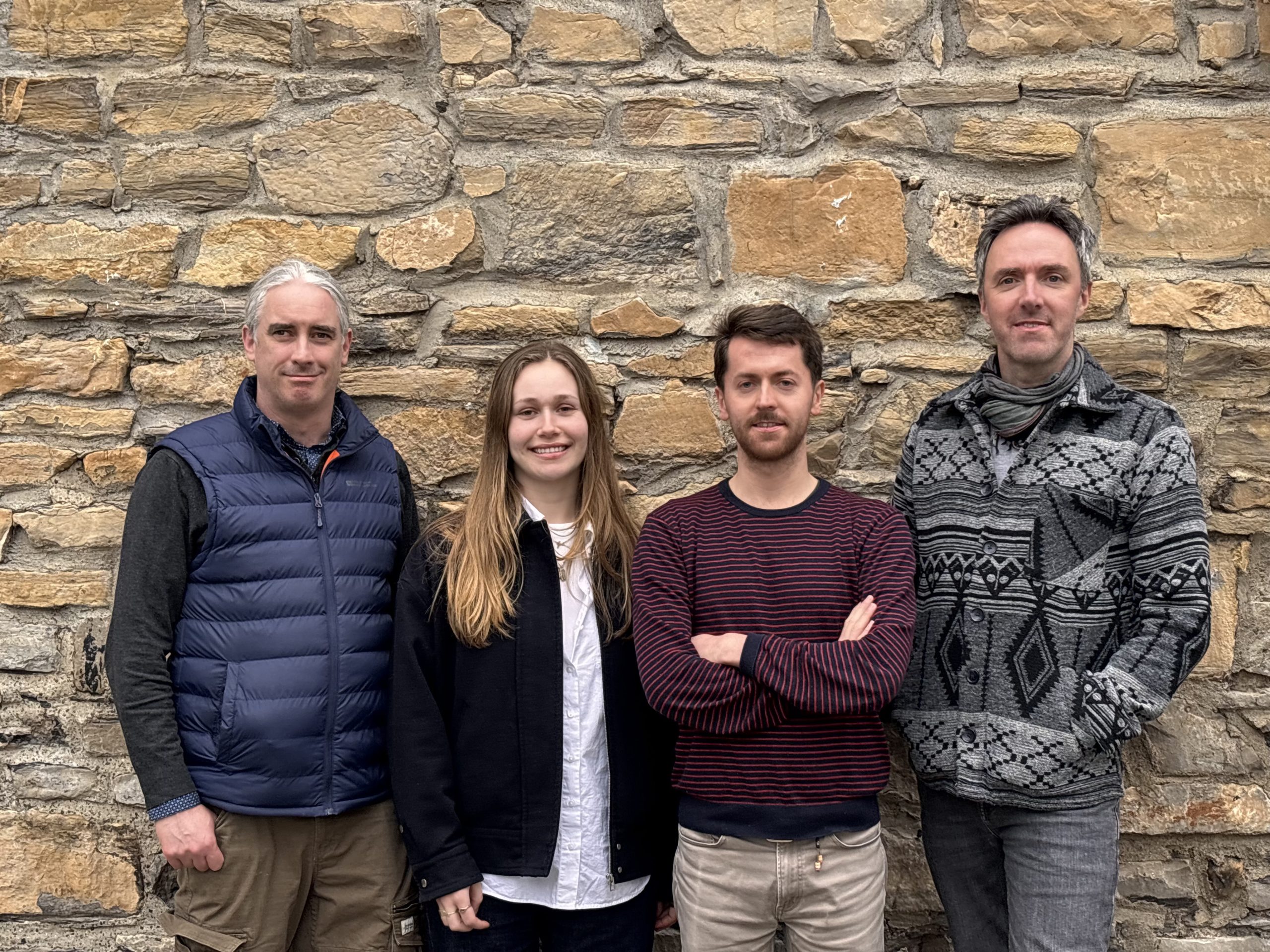 Group of people standing at wall
